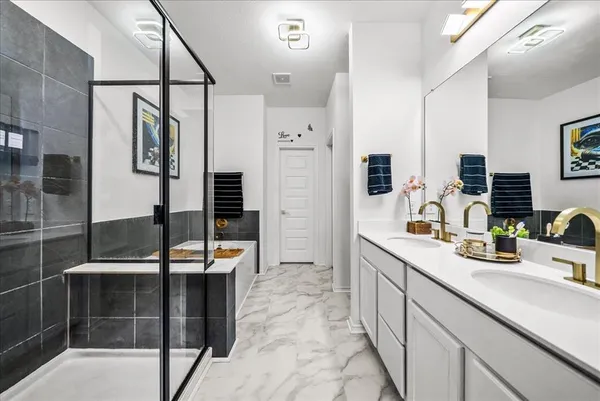 a kitchen with stainless steel appliances a sink and cabinets
