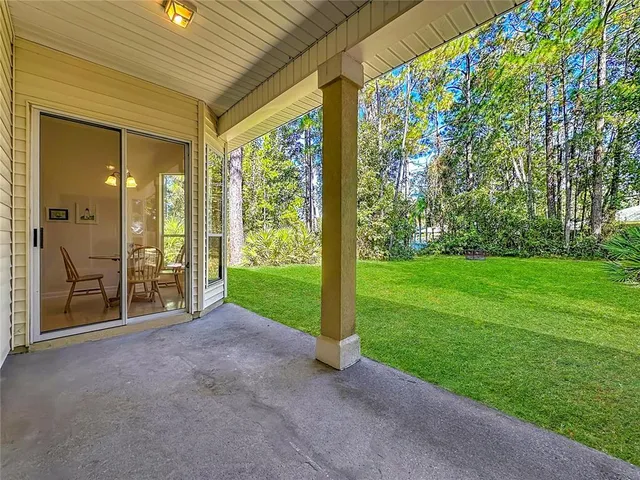 a view of a garden with an outdoor seating