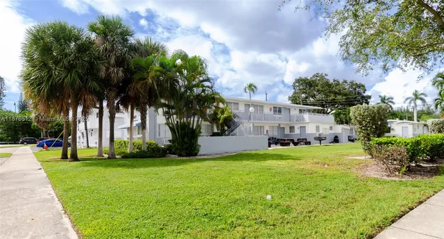 a view of a backyard with a garden and plants