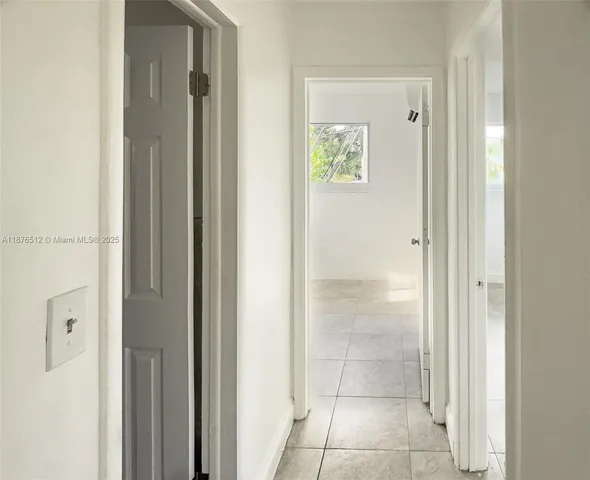 a view of a bathroom from the hallway