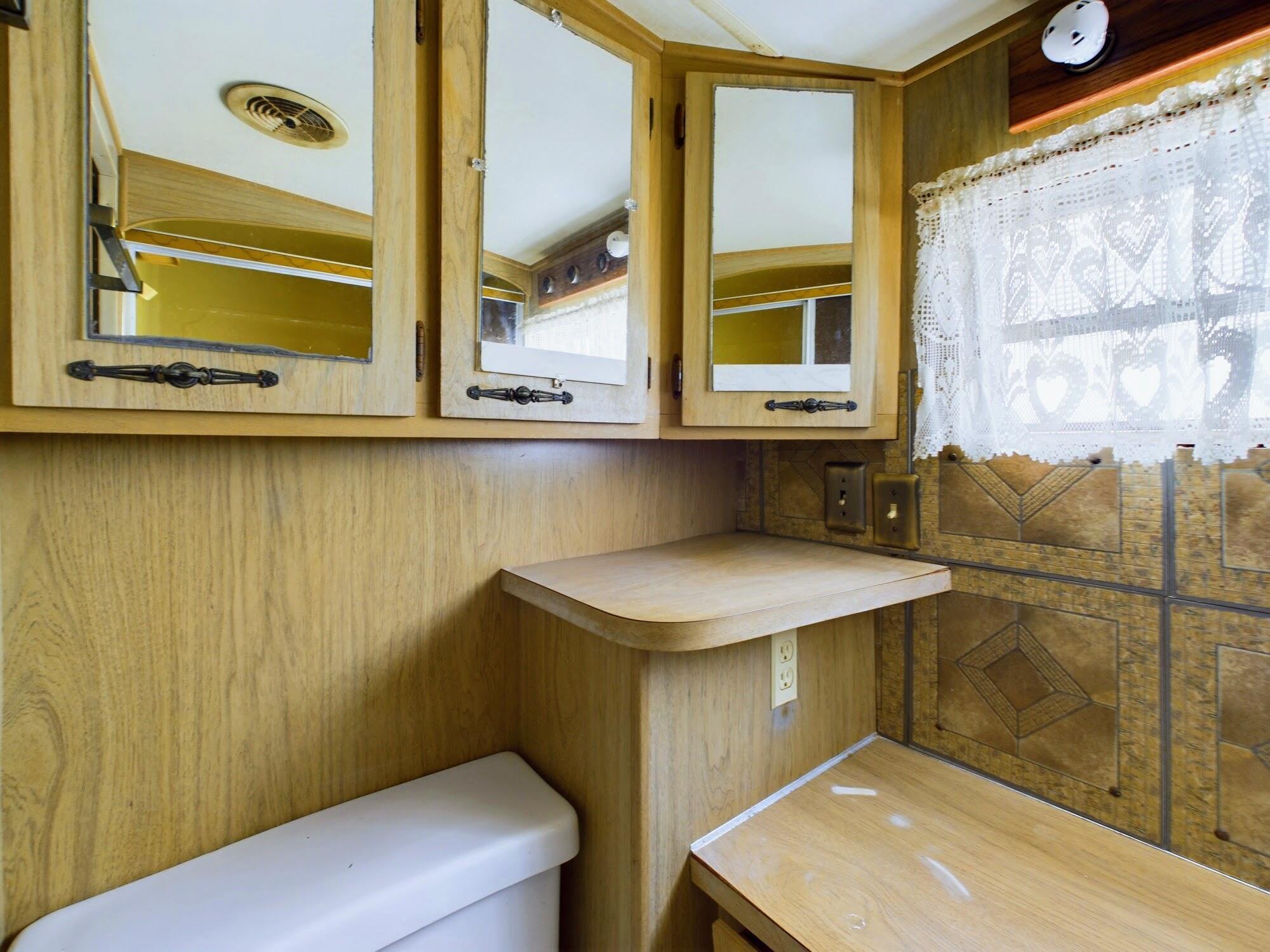 1224001 Holopaw Groves Rd Street St. Cloud, FL 34773 - Photo 52 of 99 a bathroom with a sink and a window
