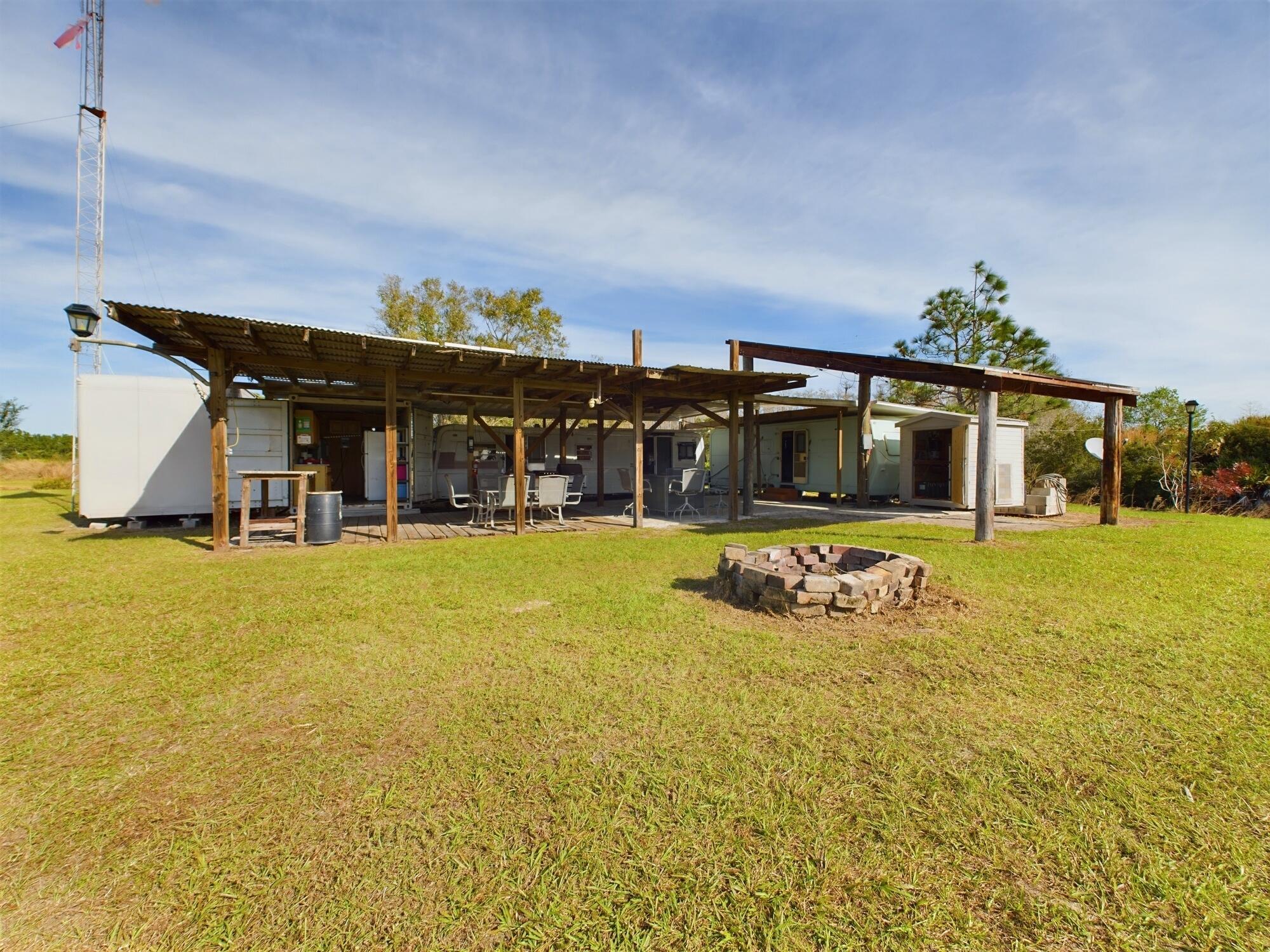 1224001 Holopaw Groves Rd Street St. Cloud, FL 34773 - Photo 74 of 99 a view of a house with swimming pool