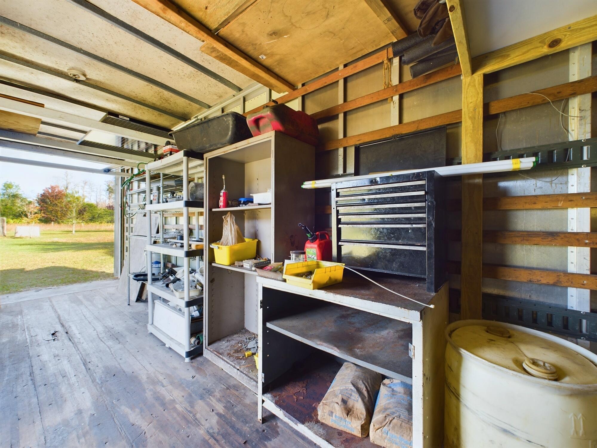 1224001 Holopaw Groves Rd Street St. Cloud, FL 34773 - Photo 78 of 99 a view of storage and utility room
