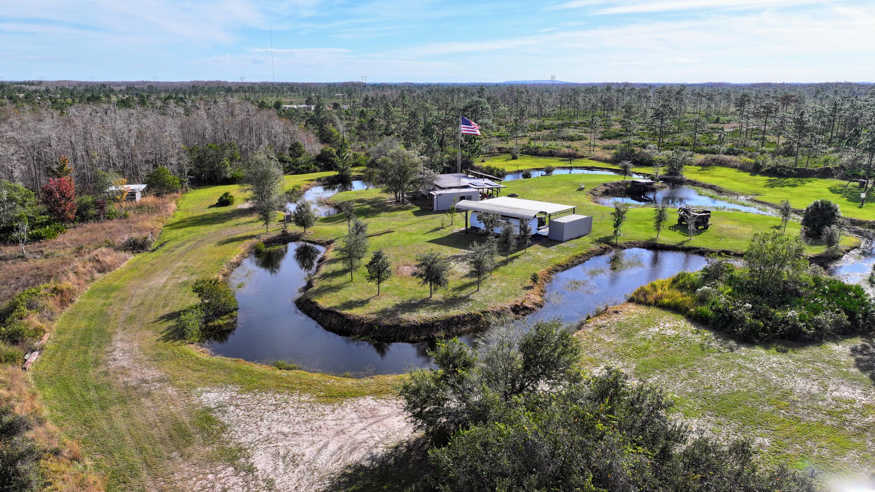 1224001 Holopaw Groves Rd Street St. Cloud, FL 34773 - Photo 86 of 99 dji_fly_20231207_100934_0102_17019766881