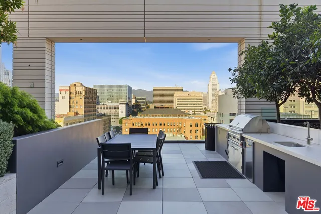 a view of dinning table and chairs in the balcony