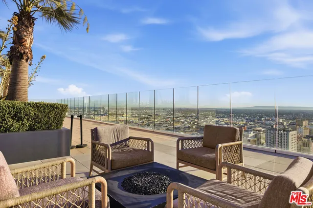 a view of roof deck with patio