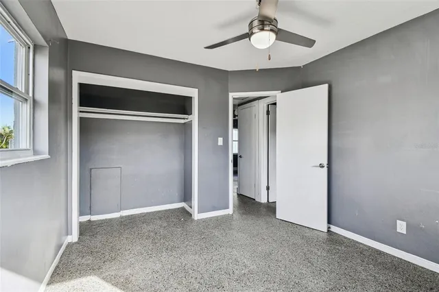 a view of a house with backyard and porch