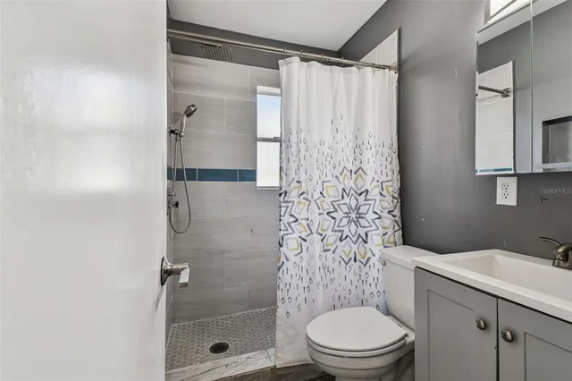 a view of a house with backyard porch and sitting area