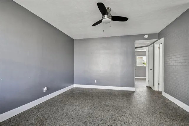 a view of a kitchen with a sink and dishwasher a refrigerator with wooden floor