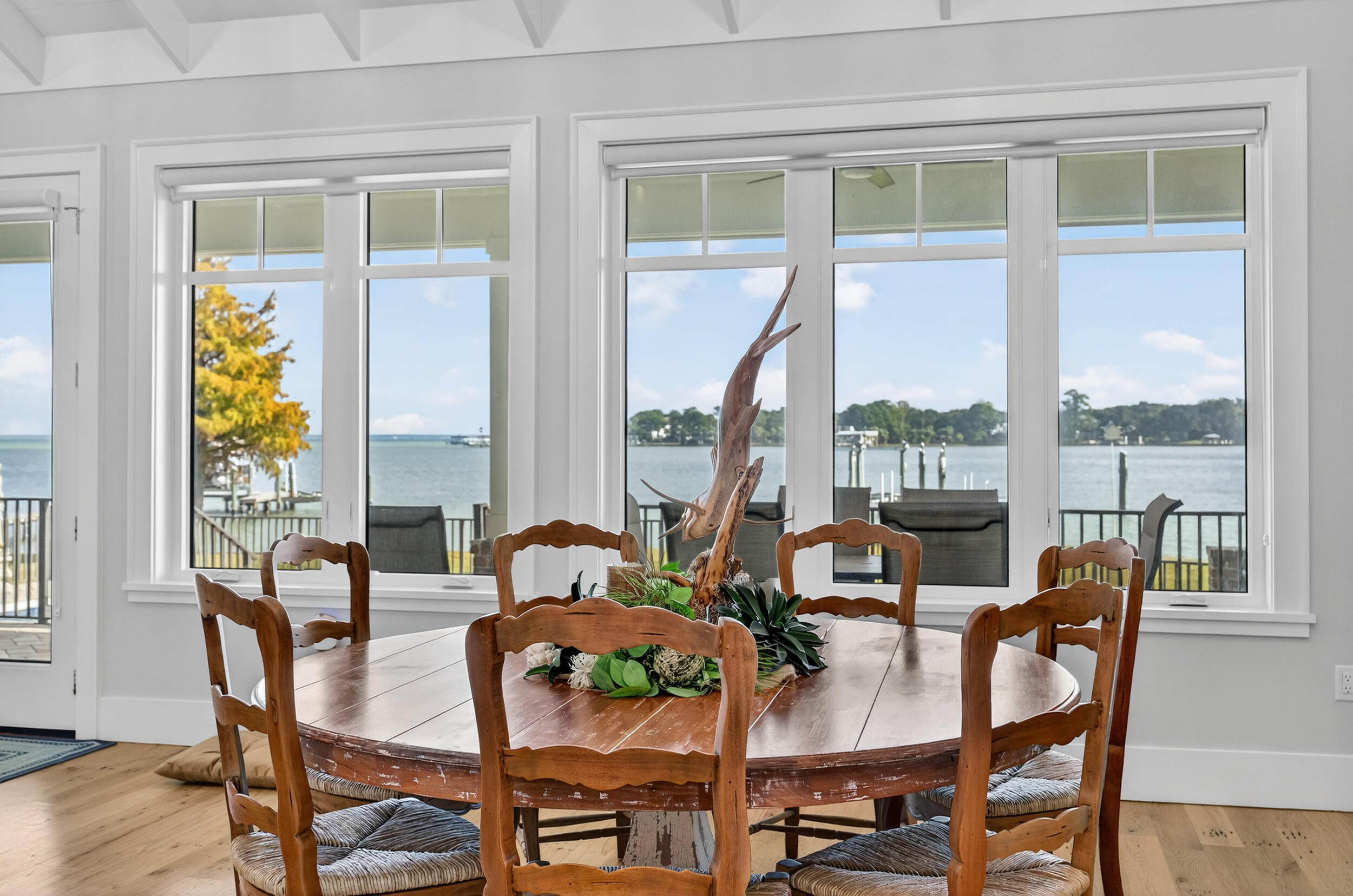 901 Peacock's Point Drive Destin, FL 32541 - Photo 18 of 64 a view of a dining room with furniture large windows and wooden floor