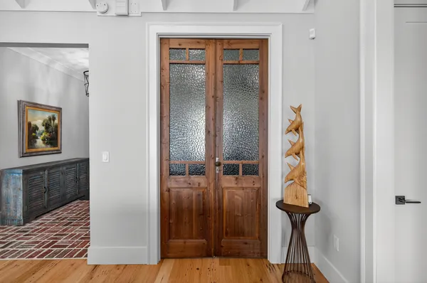 a bathroom with a sink a window and shower