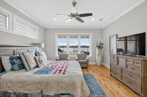 a bedroom with a bed and a dresser in it