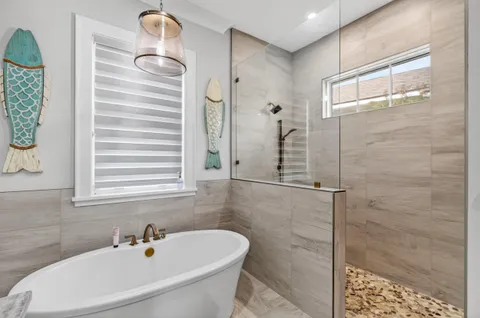 a balcony with furniture and a potted plant