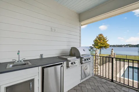 a bathroom with a toilet a sink and a mirror