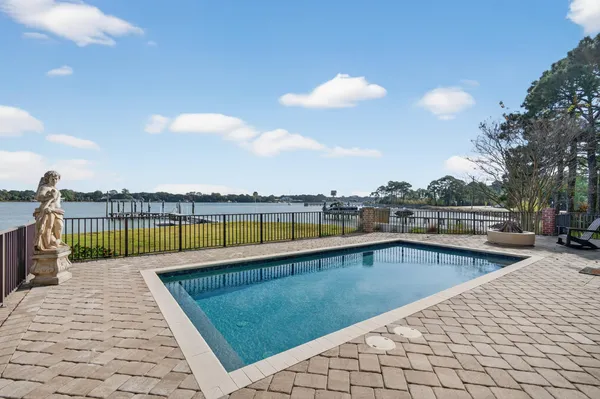 an aerial view of a residential houses with outdoor space