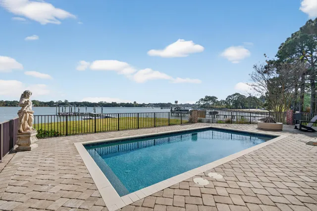 an aerial view of a residential houses with outdoor space