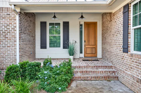 a living room with furniture and windows