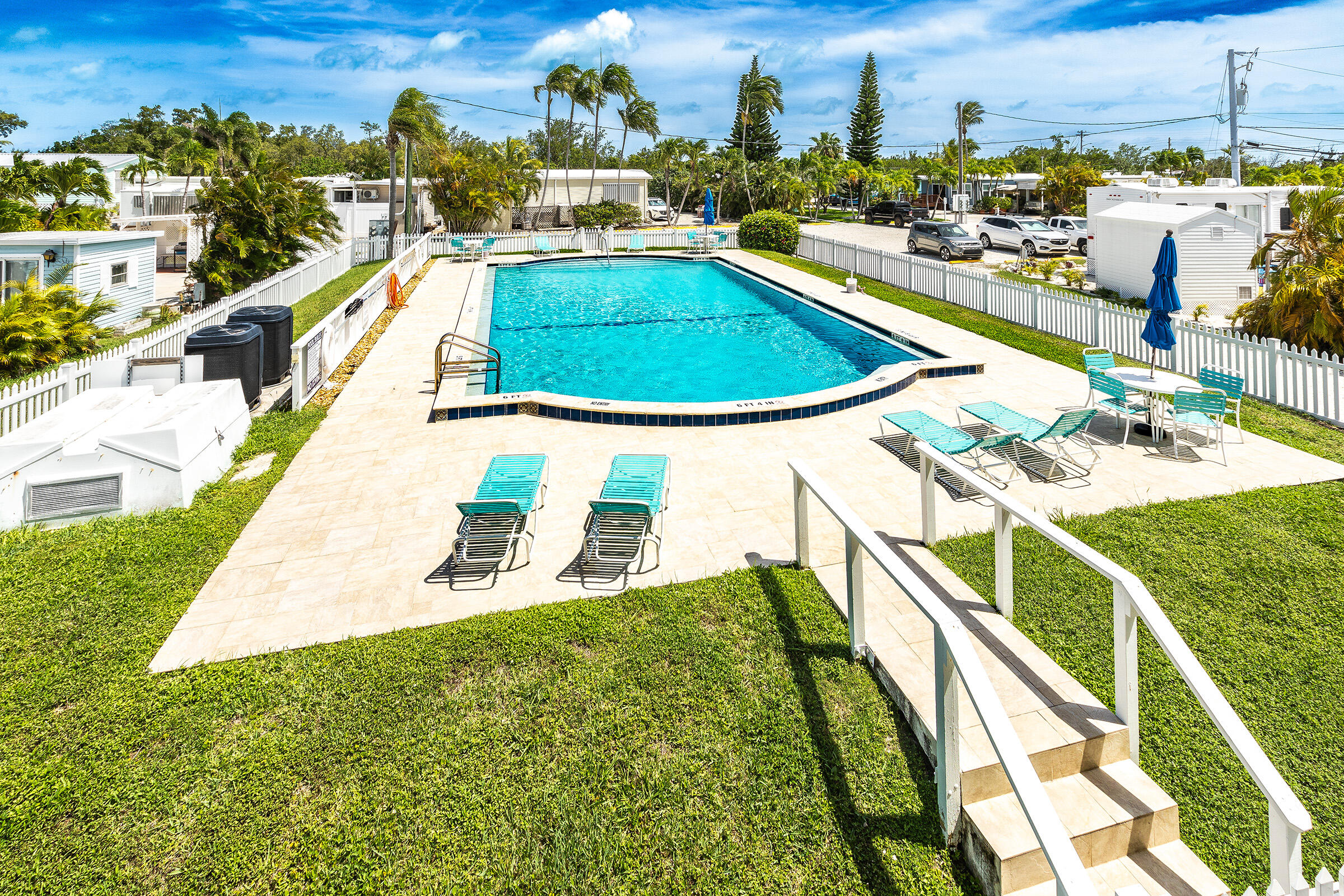 55 Boca Chica Road, Unit 27 Key West, FL 33040 - Photo 15 of 20 a view of a swimming pool with seating area