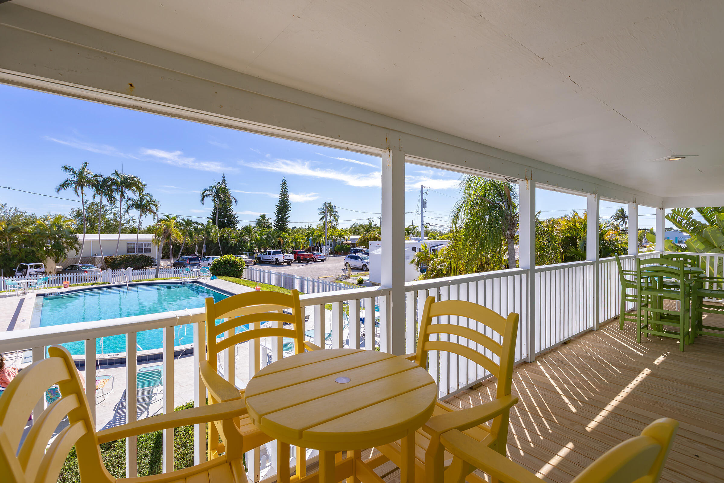 55 Boca Chica Road, Unit 27 Key West, FL 33040 - Photo 16 of 20 a view of a balcony with wooden floor