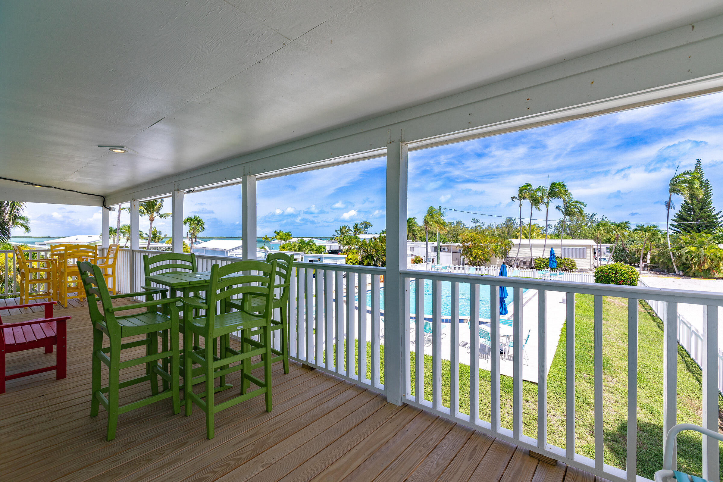 55 Boca Chica Road, Unit 27 Key West, FL 33040 - Photo 17 of 20 a view of a chairs and table in patio