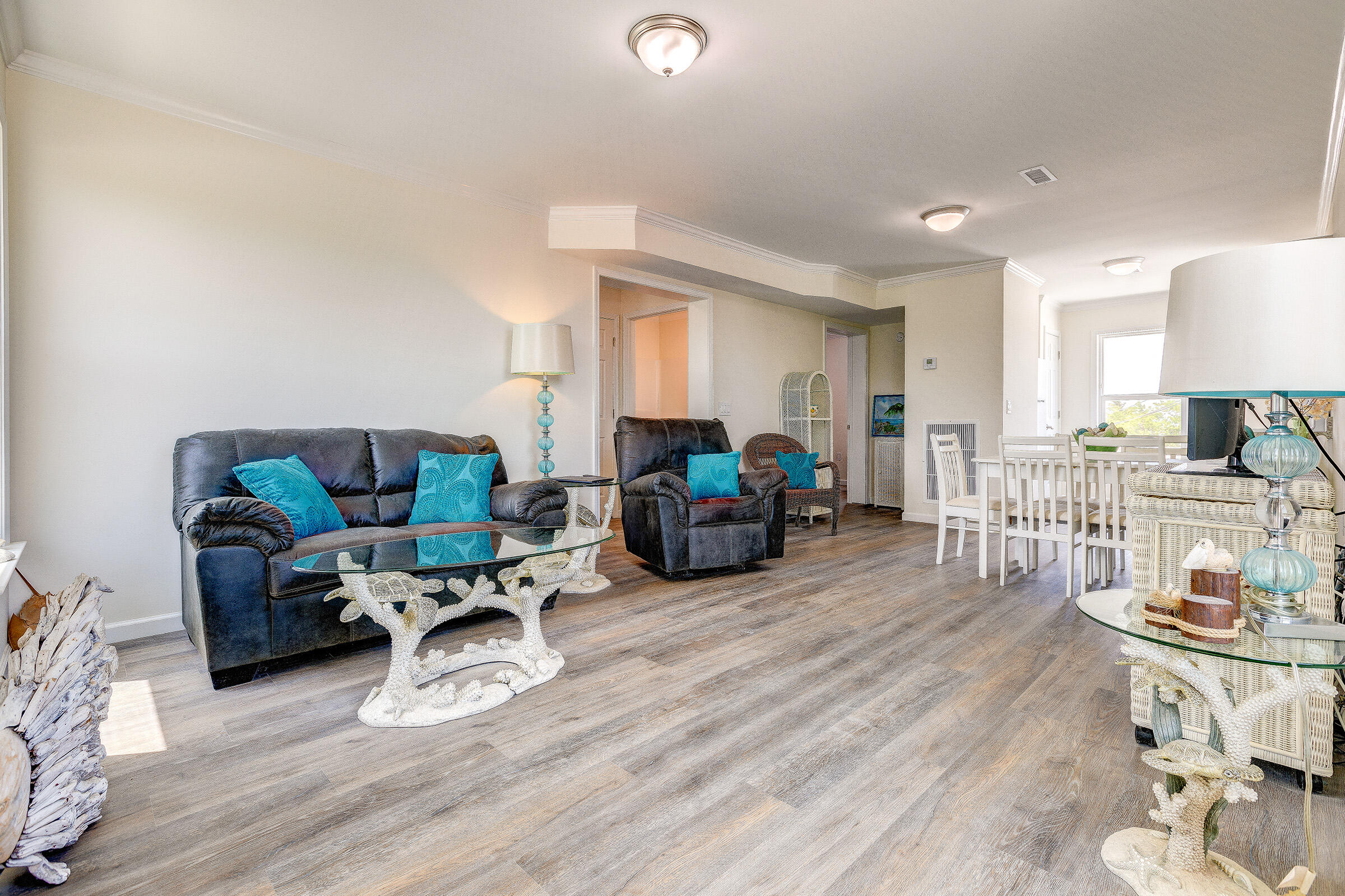 55 Boca Chica Road, Unit 27 Key West, FL 33040 - Photo 4 of 20 a living room with furniture and a wooden floor