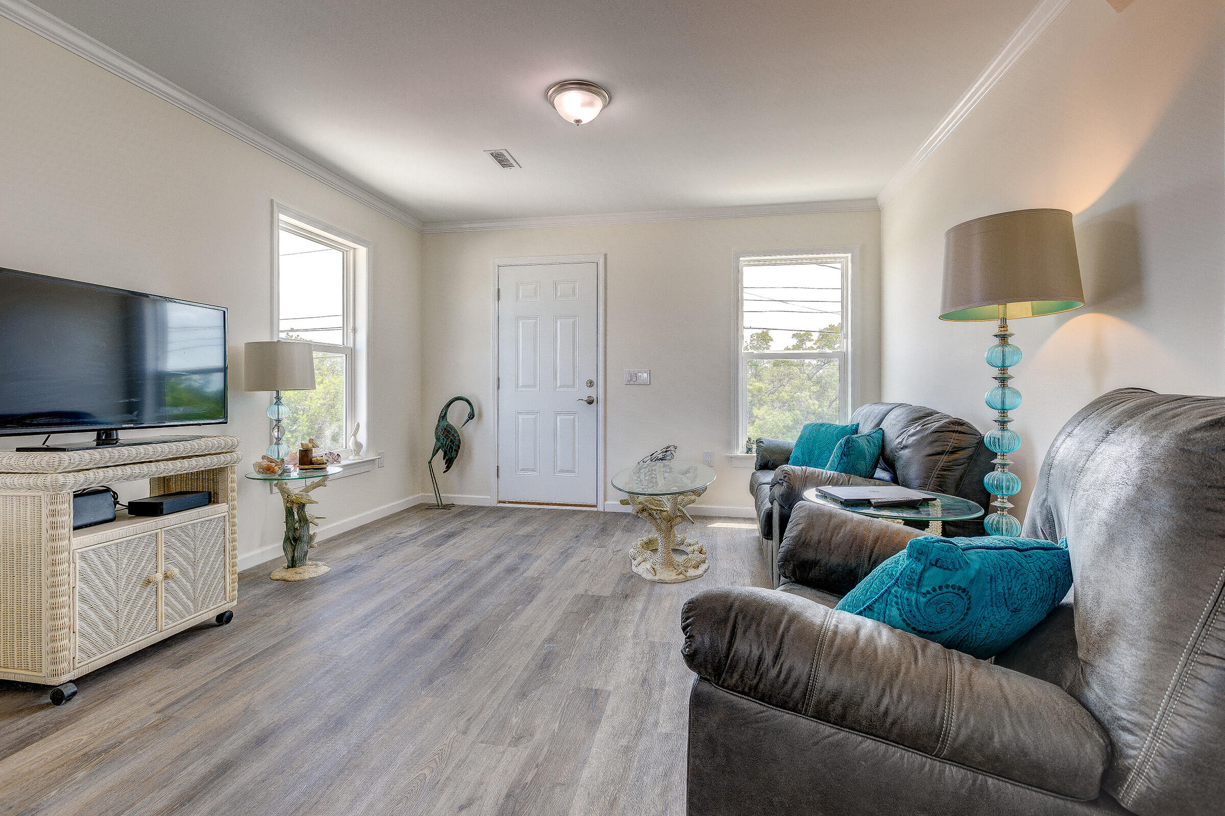 55 Boca Chica Road, Unit 27 Key West, FL 33040 - Photo 5 of 20 a living room with furniture and a flat screen tv