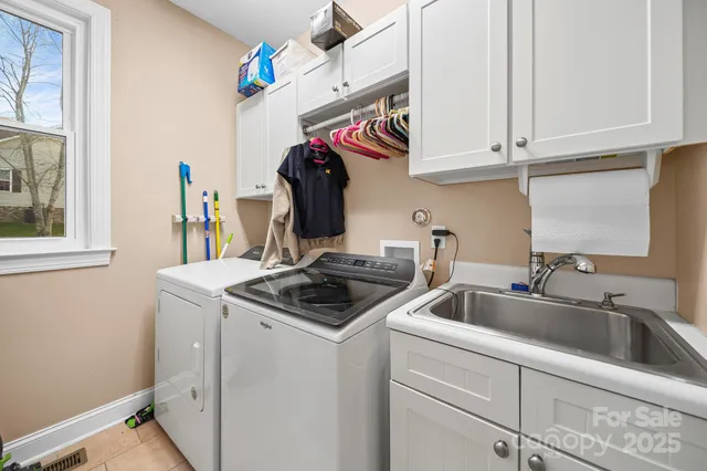 a kitchen with stainless steel appliances granite countertop a sink and cabinets