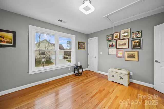 a view of a livingroom with furniture and a flat screen tv