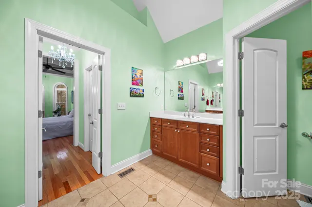 a view of a bathroom from a hallway