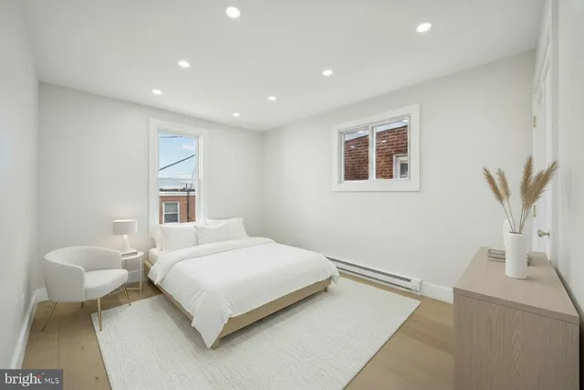 a bedroom with a large bed and a couch