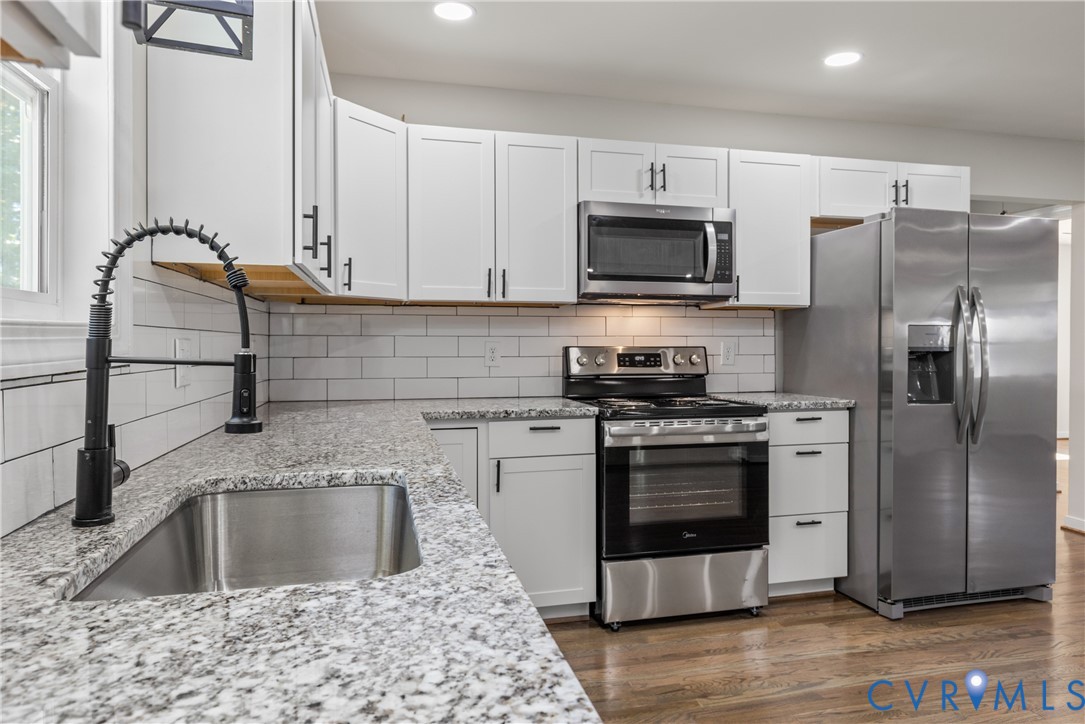 8409 Hopkins Road North Chesterfield, VA 23237 - Photo 3 of 51 White cabinetry, stainless steel appliances, grani