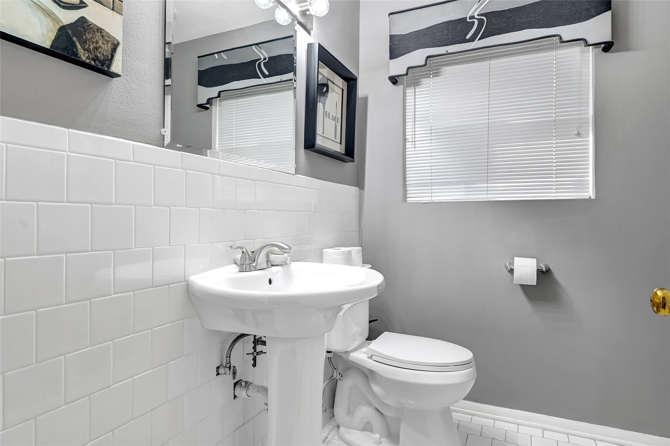 4831 Knickerbocker Street Houston, TX 77035 - Photo 35 of 50 Bathroom Vanity 1 featuring a modern sink, mirror, and built-in wall shelving for storage.