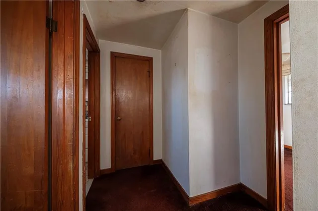 a view of a house with a small yard