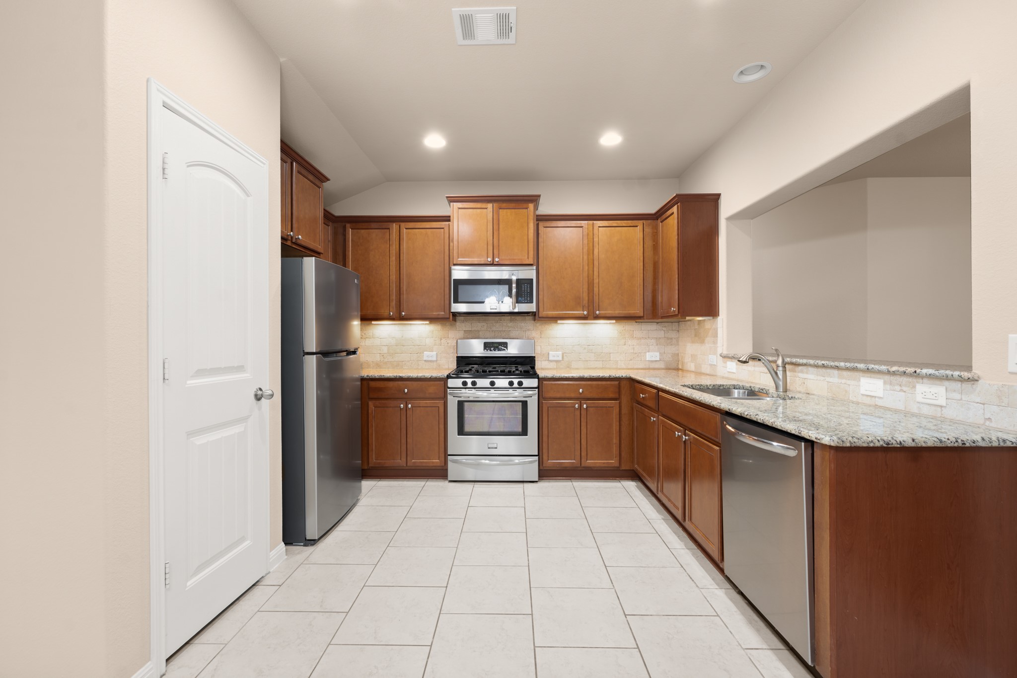 305 Longhorn Cavern Road Leander, TX 78641 - Photo 4 of 21 This kitchen is a chef's dream! Modern stainless steel appliances, rich wood cabinetry, and a layout that makes meal prep a breeze.