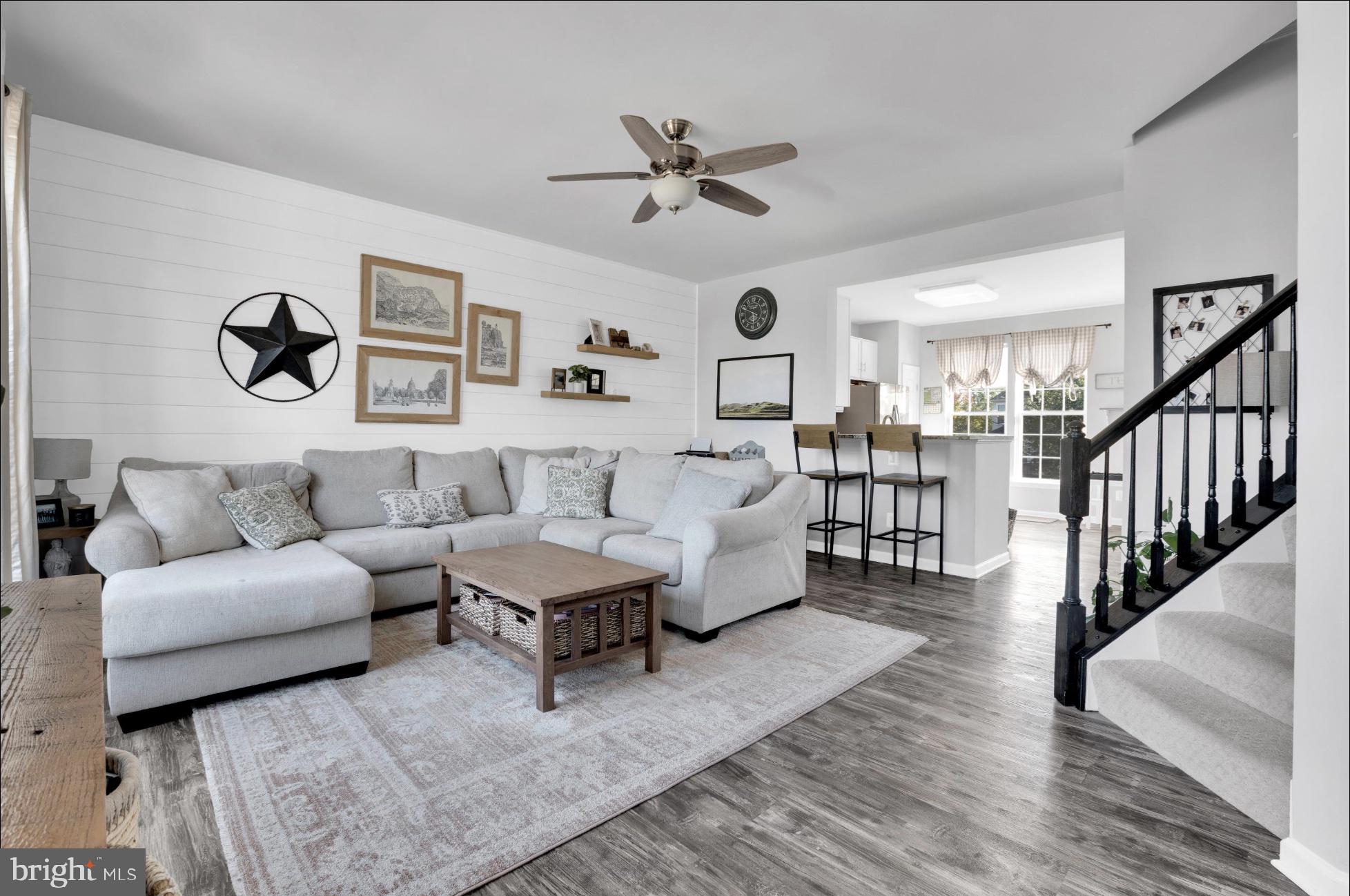a living room with furniture and white walls