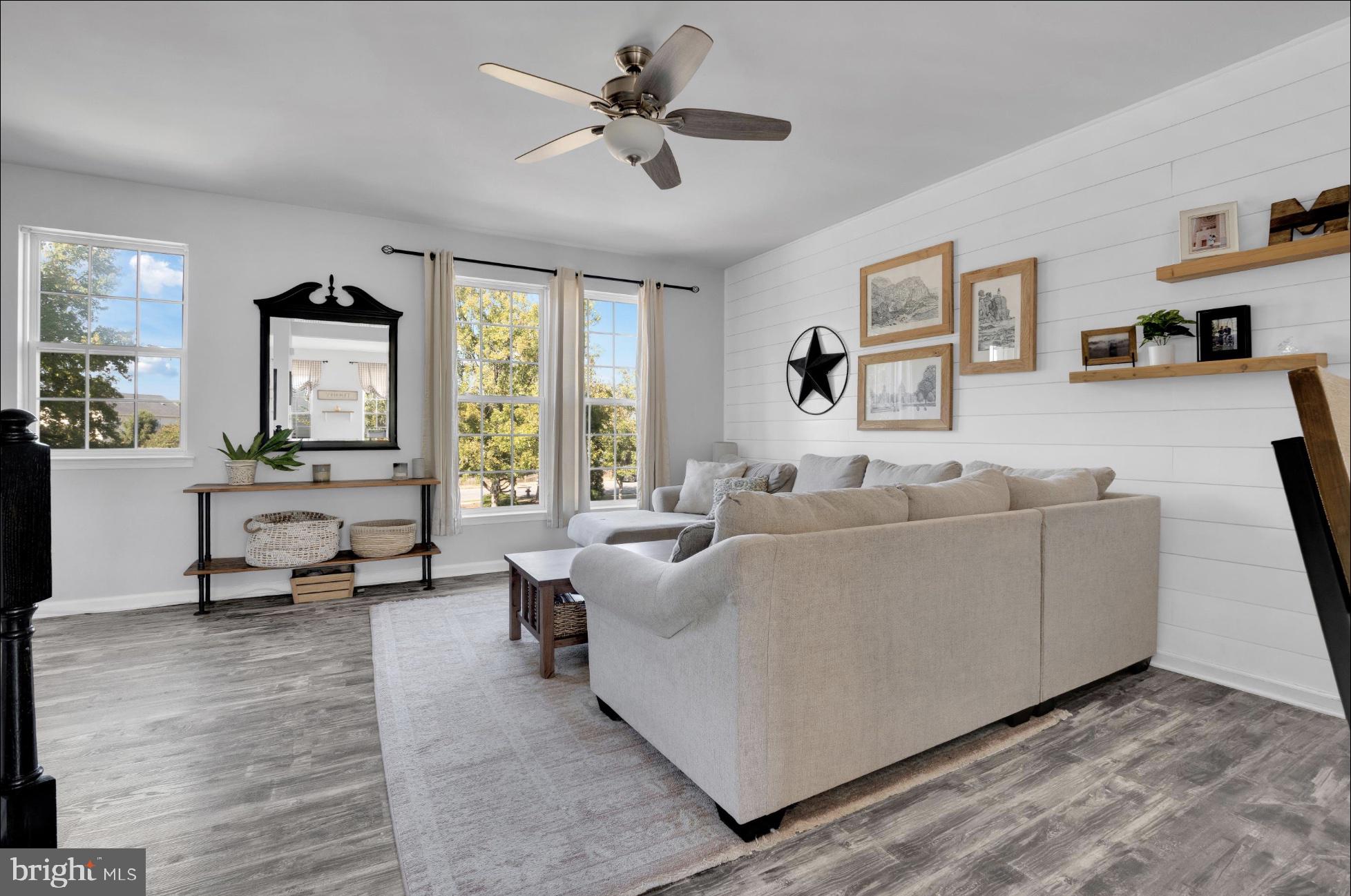 25336 Sweetness Terrace Aldie, VA 20105 - Photo 11 of 33 a living room with furniture and a large window