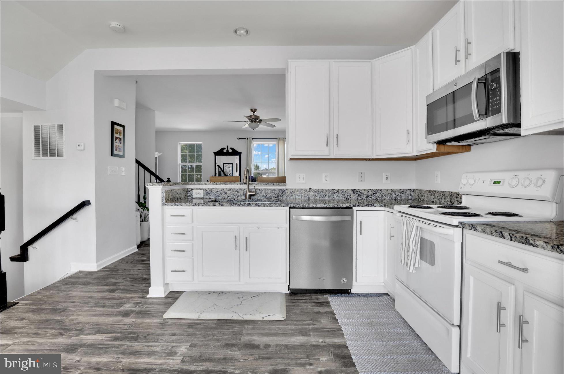 25336 Sweetness Terrace Aldie, VA 20105 - Photo 15 of 33 a kitchen with stainless steel appliances granite countertop a sink and a stove