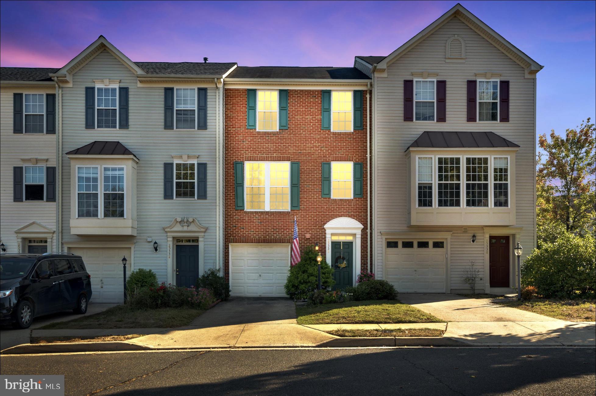 25336 Sweetness Terrace Aldie, VA 20105 - Photo 2 of 33 a front view of a house with garden