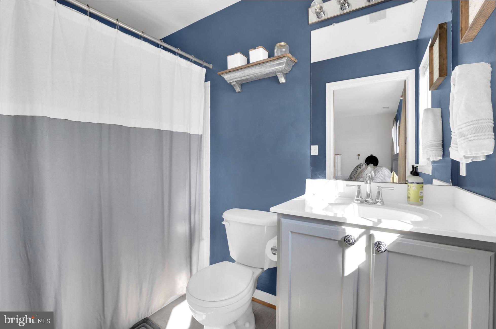 25336 Sweetness Terrace Aldie, VA 20105 - Photo 22 of 33 a bathroom with a granite countertop sink toilet and mirror