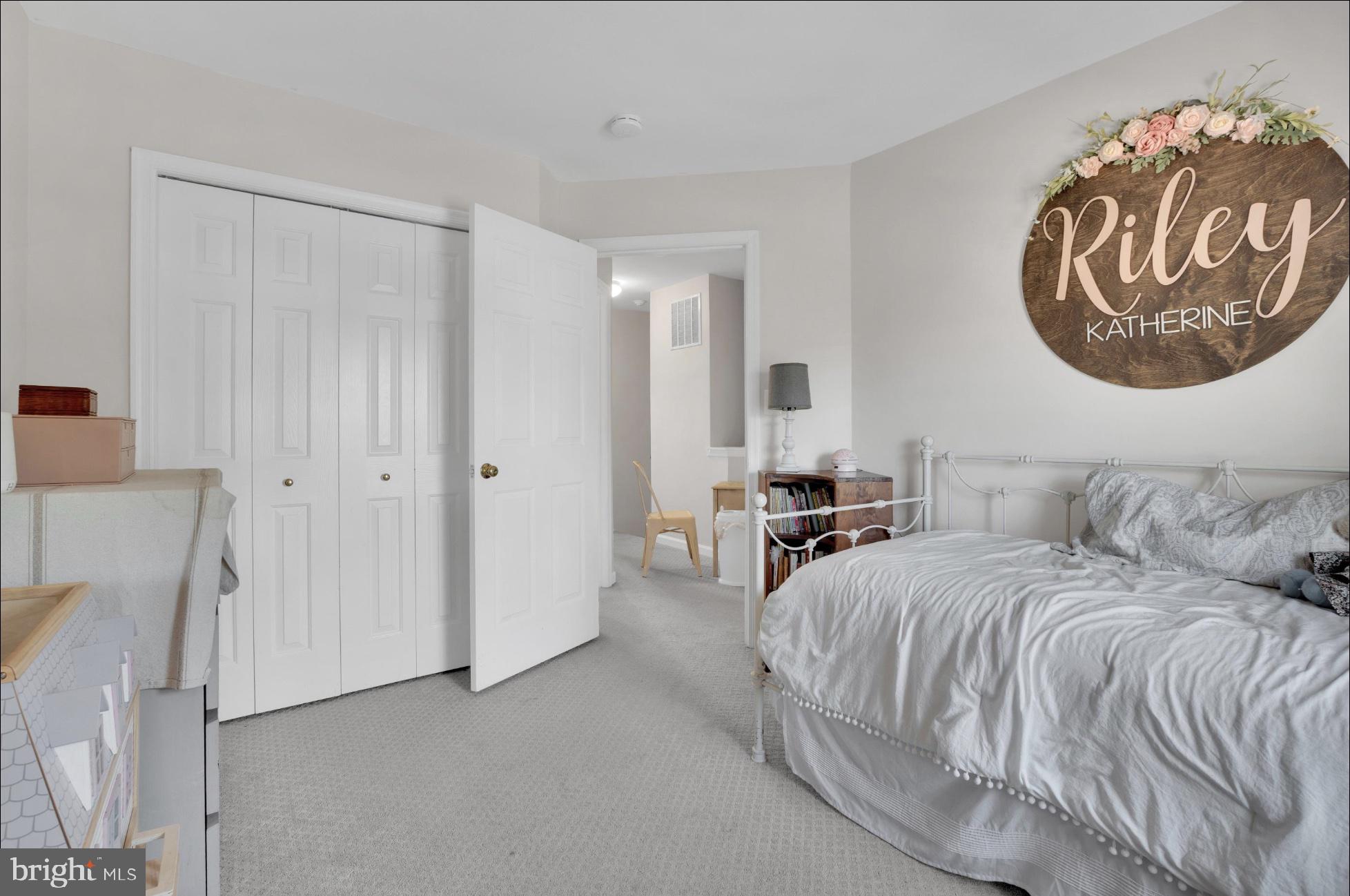 25336 Sweetness Terrace Aldie, VA 20105 - Photo 24 of 33 a bedroom with a bed and a painting on the wall