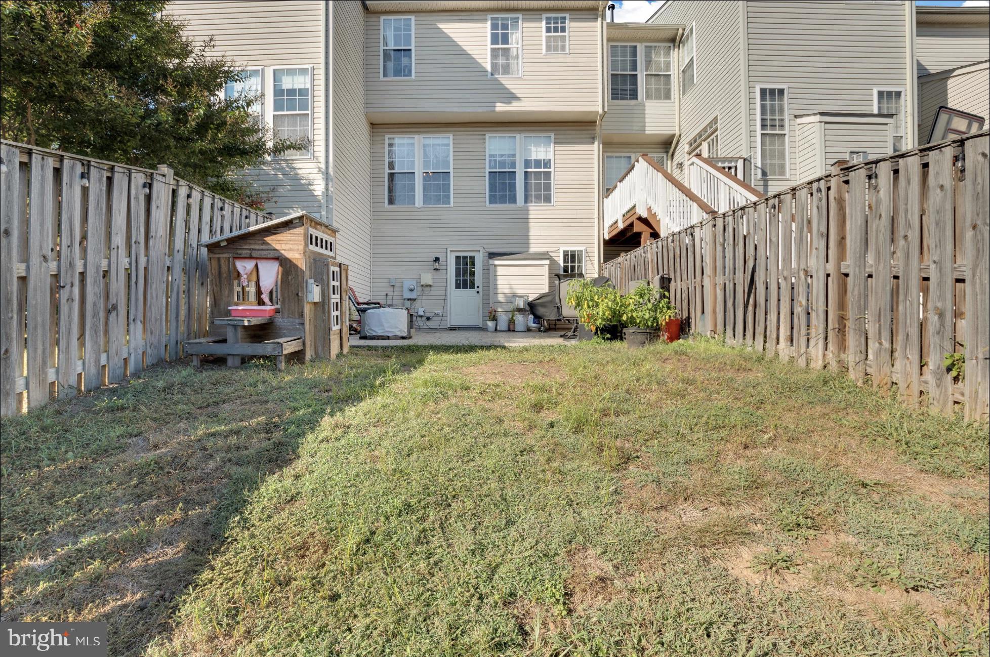 25336 Sweetness Terrace Aldie, VA 20105 - Photo 28 of 33 a view of a house with backyard and porch