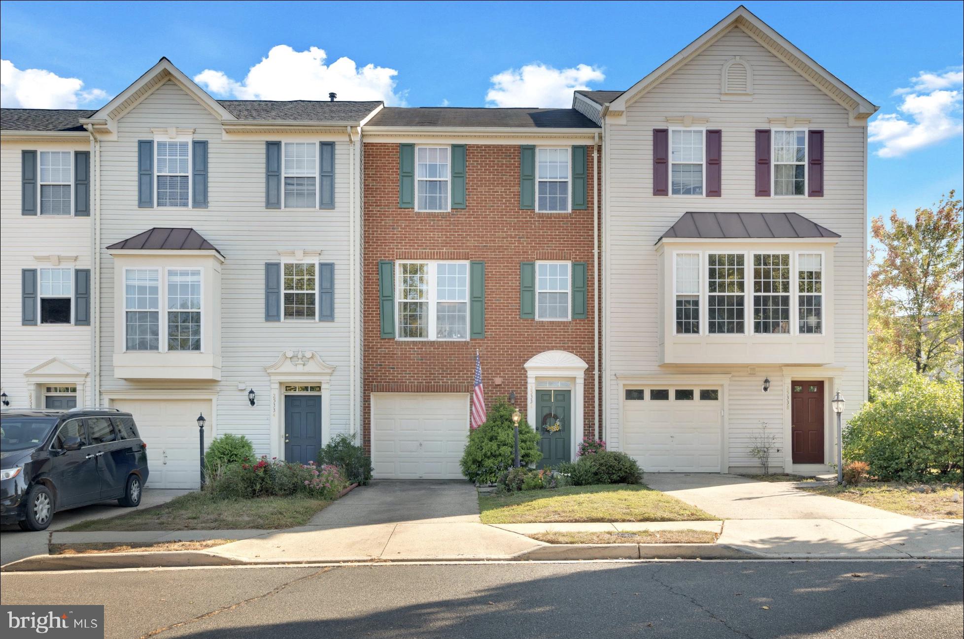 25336 Sweetness Terrace Aldie, VA 20105 - Photo 4 of 33 a front view of a house with a yard and potted plants