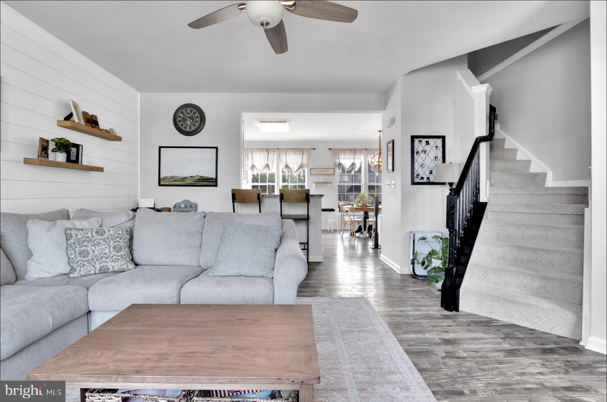 25336 Sweetness Terrace Aldie, VA 20105 - Photo 10 of 33 a living room with furniture and a clock