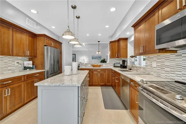 a bathroom with a granite countertop toilet sink and mirror