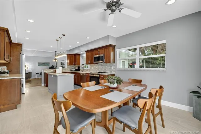 a bedroom with a bed and a flat tv screen on dresser