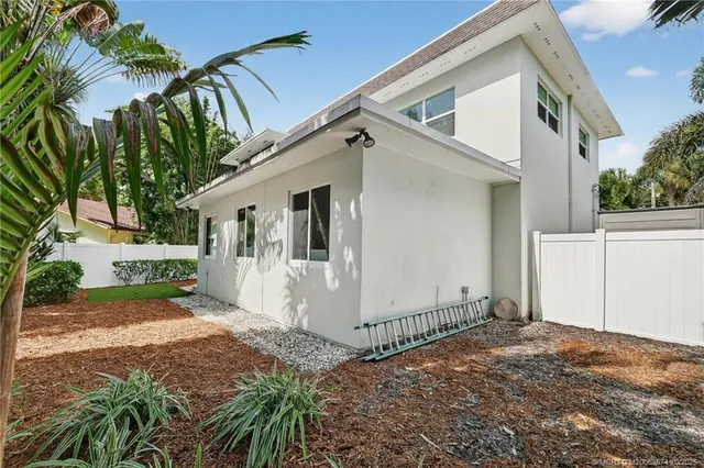 an aerial view of a house with yard swimming pool and outdoor seating