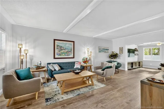 a dining room livingroom with furniture and kitchen view