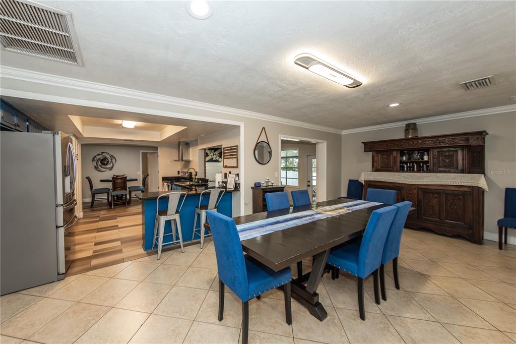 5584 North Dean Road Orlando, FL 32817 - Photo 13 of 39 a view of a dining room with furniture