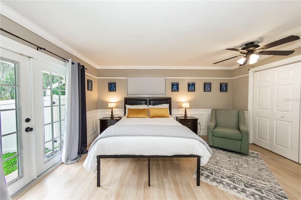 5584 North Dean Road Orlando, FL 32817 - Photo 23 of 39 a bedroom with a bed couch and window