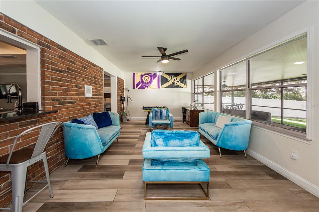 5584 North Dean Road Orlando, FL 32817 - Photo 27 of 39 a living room with furniture and a large window
